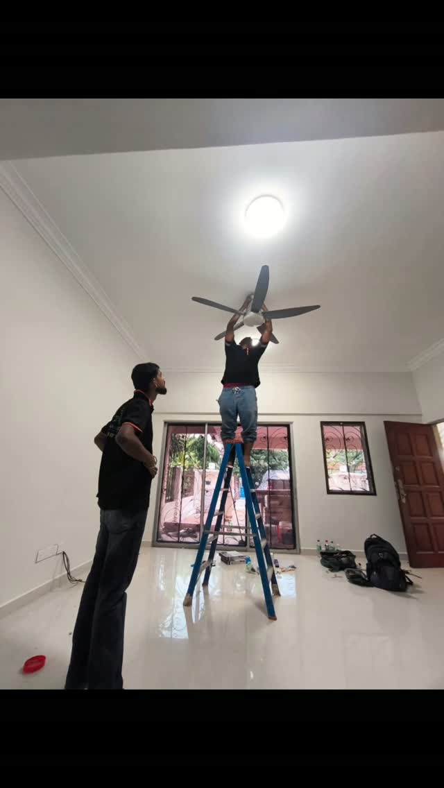 Ceiling fan installation in a modern living room